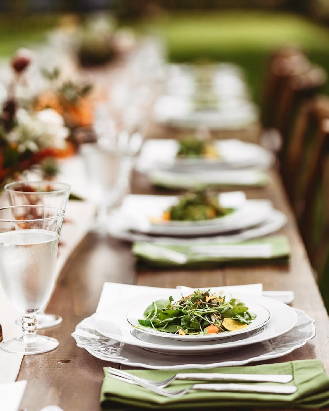 Plated wedding dinner on an outdoor table